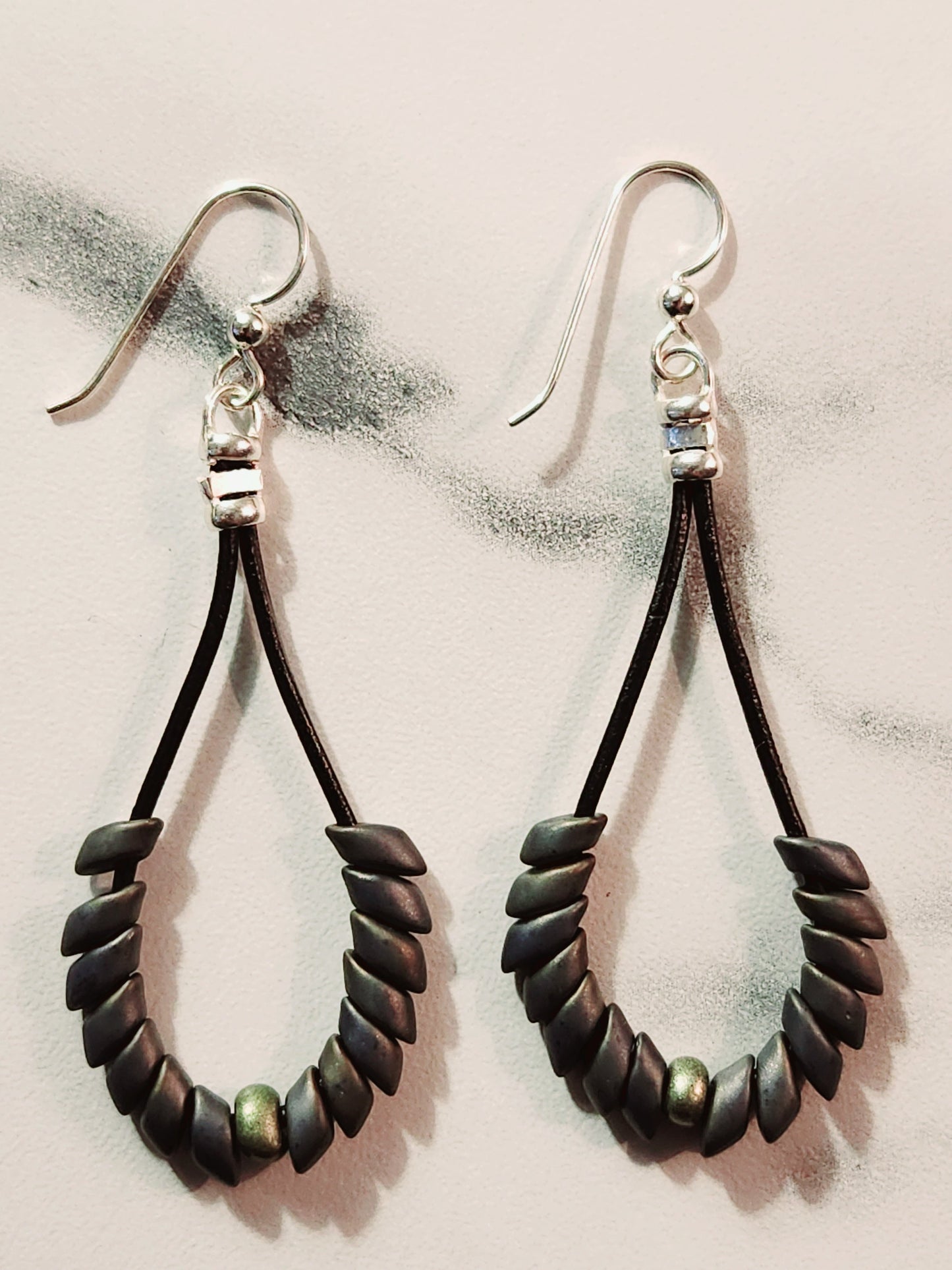 Gray Phonenix feather earrings