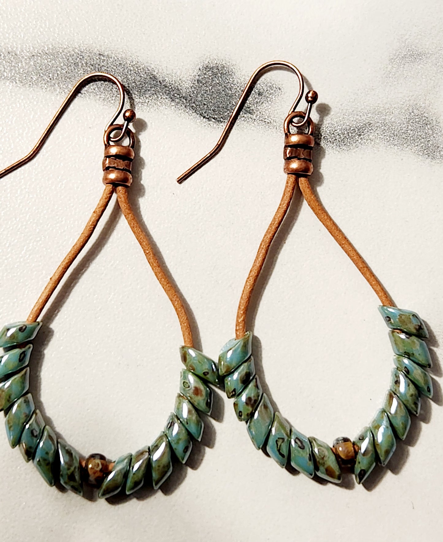 Teal phoenix feather earrings